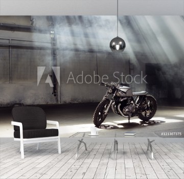 Picture of Motorcycle standing in dark building in rays of sunlight